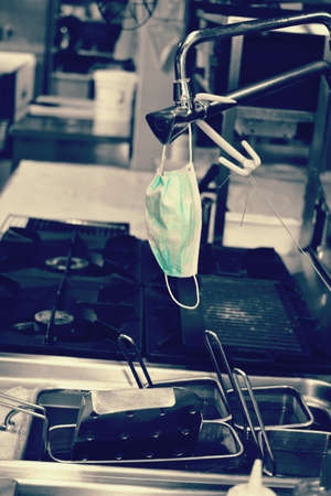 isolated concept mask in a business kitchenの写真素材