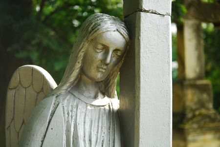 Beautiful angel statue in a old graveyardの写真素材