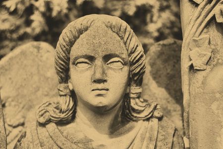old style photo of woman statue in old cemeteryの写真素材