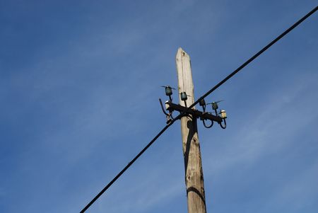 high voltage power line on the blue skyの写真素材