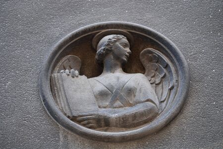 stone relief of the old angel sign の写真素材