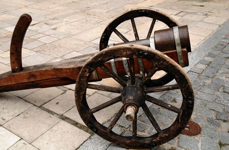 Old gun on wheels about a fortification.の写真素材