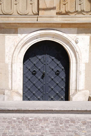 Old door with ornament in stone wall. Royal Wawel Castle, Cracow. Polandの写真素材