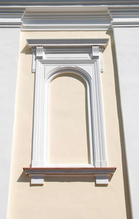 window in an old stone wall of the castleの写真素材