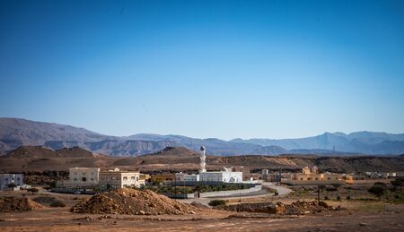 Mosque with a mountain in the background towards Sur, Omanの写真素材