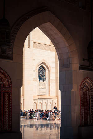 Muscat, Oman, December 27, 2019: Men praying at the Sultan Qaboos Grand Mosqueのeditorial素材