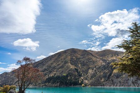 Beautiful lake with mountain in the background taken on a sunny day, New Zealandの写真素材