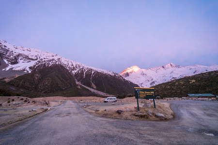 Aoraki Mt., New Zealand, October 3, 2019: Beautiful sunrise at White Horse Hill Camp at the foot of Aoraki Mt. with a parked caravanのeditorial素材