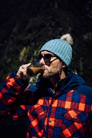 Milford Sound, New Zealand, October 5, 2019: Gorgeous image of a handsome dark-haired boy with a...