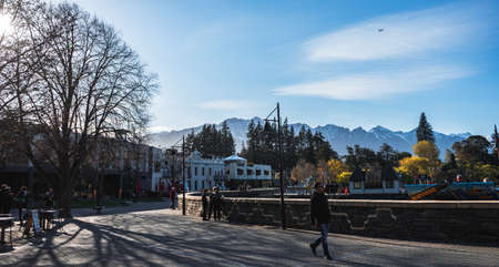 Queenstown, New Zealand, October 6, 2019: Beautiful morning picture of the town center with the snow capped mountains in the backgroundのeditorial素材
