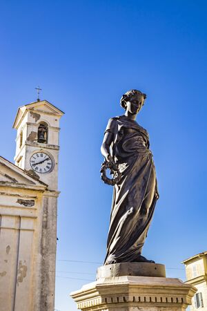 Municipal Theater Gian Lorenzo Bernini, housed in a deconsecrated church. Fountain with statue of the goddess Flora. Bell tower with clock. Ariccia, Castelli Romani, Lazio, Italy.の写真素材