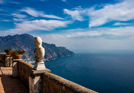 October 14, 2018 - Ravello, Campania, Italy - The spectacular panorama that can be admired from the Terrace of the Infinity, in Villa Cimbrone, on the Amalfi coast. The blue sky and some marble busts.のeditorial素材