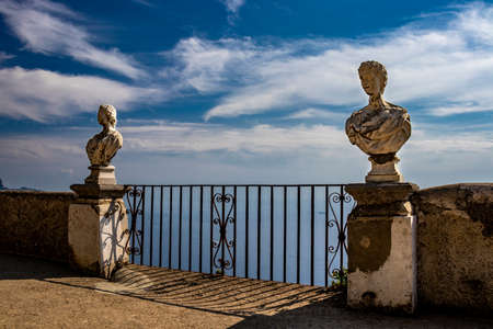 October 14, 2018 - Ravello, Campania, Italy - The spectacular panorama that can be admired from the Terrace of the Infinity, in Villa Cimbrone, on the Amalfi coast. The blue sky and some marble busts.のeditorial素材