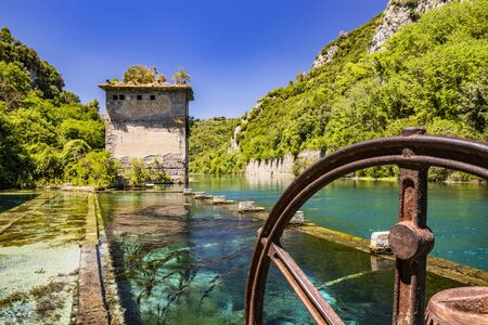 The Roman port of ancient Narnia (Narni), in Stifone, in the canyons of the Nera river. The blue sky and the clear, cold and turquoise water, on a sunny day, in the summer. Wild and pristine nature. の写真素材