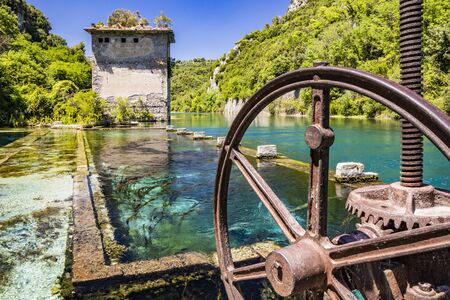 The Roman port of ancient Narnia (Narni), in Stifone, in the canyons of the Nera river. The blue sky and the clear, cold and turquoise water, on a sunny day, in the summer. Wild and pristine nature. の写真素材