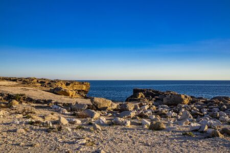 The amazing panorama of the sea with the rocks, in Porto Miggiano. Bleak and rocky landscape with a splendid view of the sea. Santa Cesarea Terme, Puglia, Salento, Italy.の写真素材