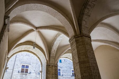 The Palazzo del PodestÃ , in Piazza dei Priori in the ancient medieval village of Narni. The porch with the cross vault. Umbria, Terni, Italy.の写真素材