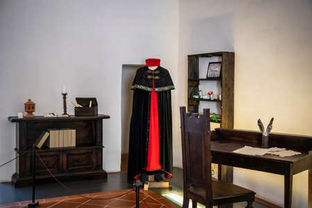 June 30, 2019 - Narni, Umbria, Italy - Interior rooms of the medieval castle, in the ancient village of Narni. Antique wooden desks for monks and copyists. Old manuscripts.のeditorial素材