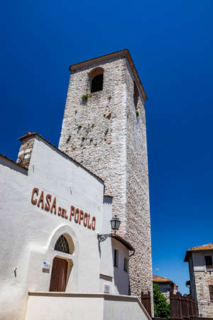 June 30, 2019 - Narni, Umbria, Italy - A medieval tower in the ancient village of Narni. The "House of the People". Blue sky in the summer.のeditorial素材
