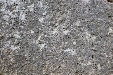 The ancient megalithic walls surround the acropolis of Amelia, in Umbria, Italy. Texture composed of huge blocks of stone, with irregular boulders interlocked together.の写真素材