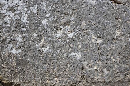 The ancient megalithic walls surround the acropolis of Amelia, in Umbria, Italy. Texture composed of huge blocks of stone, with irregular boulders interlocked together.の写真素材