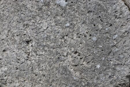 The ancient megalithic walls surround the acropolis of Amelia, in Umbria, Italy. Texture composed of huge blocks of stone, with irregular boulders interlocked together.の写真素材
