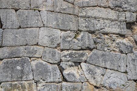 The ancient megalithic walls surround the acropolis of Amelia, in Umbria, Italy. Texture composed of...