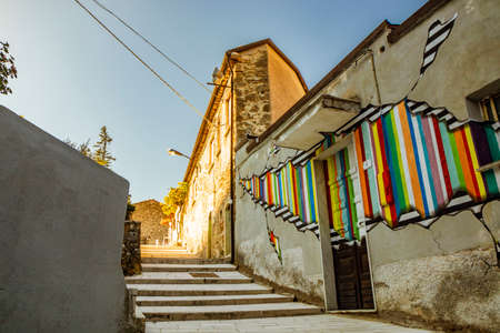 October 27, 2019 - Cerro al Volturno, Isernia, Molise, Italy - A glimpse of the ancient village with houses and alleys. Beautiful artistic murals. The steps that lead to the top of the village.のeditorial素材