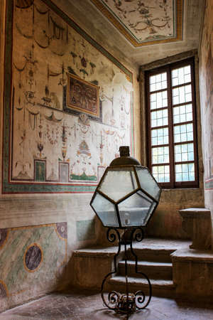 June 3, 2016 - Caprarola, Viterbo, Lazio, Italy - Villa Farnese, a Renaissance and Mannerist construction. One of the beautiful frescoes painted inside the building. Ancient lamp near a window.のeditorial素材