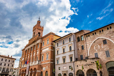 June 1, 2019 - Foligno, Perugia, Umbria, Italy - June 1, 2019 - Foligno, Perugia, Umbria, Italy - The main square of the city, with the town hall headquarters. Blue sky with white clouds in the summer.のeditorial素材
