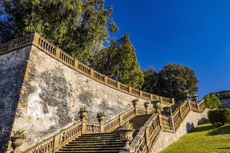 Beautiful park, public garden, with its access stairways, with lawn, hedges, trees and pots. Frascati, Rome, Lazio, Italy, Roman Castlesの写真素材