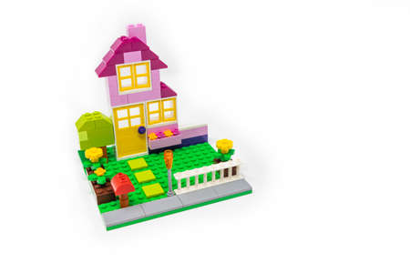 May 15, 2019 - Rome, Italy - Lego house made of classic colored building blocks, isolated on white. Concept of home, construction, investment, savings, development, family, real estate.のeditorial素材