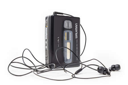 March 5, 2019 - Rome, Lazio, Italy - The original sony walkman, vintage portable cassette player, icon and symbol of the 80s and 90s. headphones isolated on white background.のeditorial素材