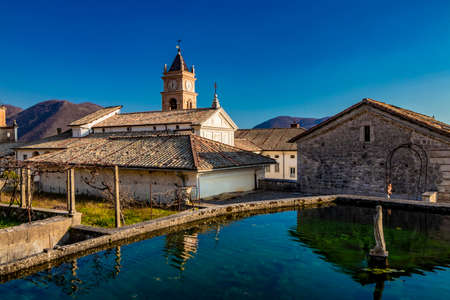 March 24, 2019 - Collepardo, Frosinone, Lazio, Italy - Trisulti Charterhouse, Carthusian monastery. A tank for collecting water (cistern) with a fountain in the center and a statue of the Virgin Mary.のeditorial素材