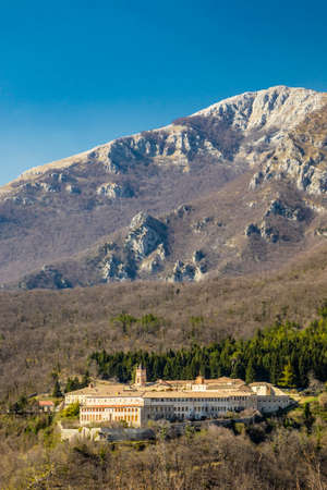 Trisulti Charterhouse is a former Carthusian e Cistercian monastery, in Collepardo, province of Frosinone, Lazio, central Italy. View of the isolated abbey in the Ernici Mountains, in winter.のeditorial素材
