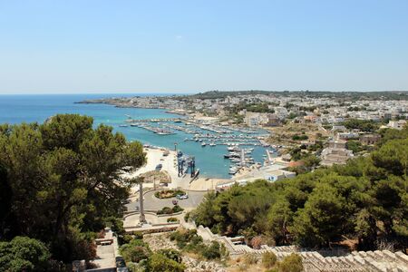 Top view of the city of Santa Maria di Leuca, in Salento, Puglia, Lecce, Italy. The sea, the blue sky and the marina.の写真素材