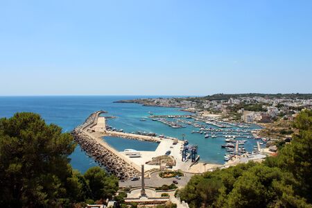 Top view of the city of Santa Maria di Leuca, in Salento, Puglia, Lecce, Italy. The sea, the blue sky and the marina.の写真素材