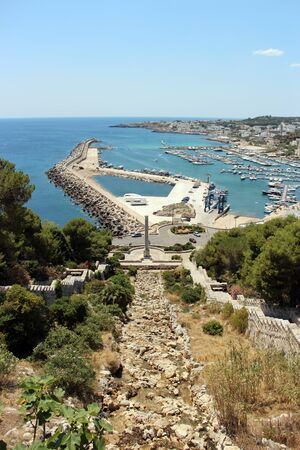 Top view of the city of Santa Maria di Leuca, in Salento, Puglia, Lecce, Italy. The sea, the blue sky and the marina.の写真素材