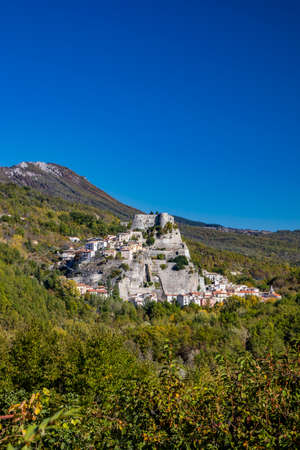 A view of the ancient village of Cerro al Volturno, surrounded by green woods and mountains. The...