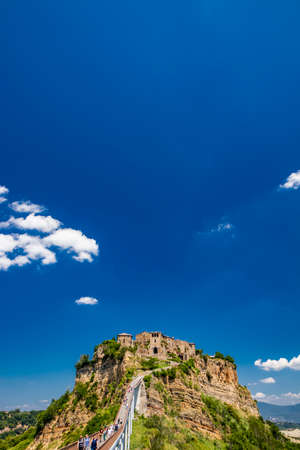 June 28, 2020 - Civita di Bagnoregio, Viterbo - View of the medieval town, located on the top of a spur of tuff rock, in the middle of the valley of the badlands. Connected by a bridge, mule track.のeditorial素材