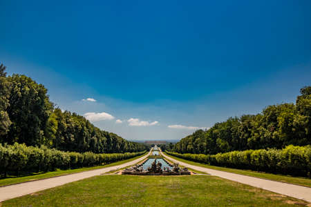 July 3, 2020 - Royal Palace of (Reggia di) Caserta - The huge and very long basin of the park's artificial lake. The perspective view, towards the waterfall and the numerous pools and water features.のeditorial素材