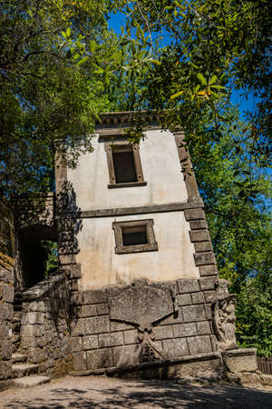 June 28, 2020 - Sacro Bosco (Sacred Grove) or Park of the Monsters of Bomarzo - Mannerist monumental garden. The Leaning House.のeditorial素材
