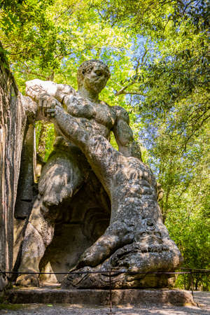 June 28, 2020 - Sacro Bosco (Sacred Grove) or Park of the Monsters of Bomarzo - Mannerist monumental garden. The big ogre with an open mouth. Text: Every thought flies.のeditorial素材