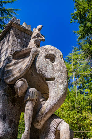 June 28, 2020 - Sacro Bosco (Sacred Grove) or Park of the Monsters of Bomarzo - Mannerist monumental garden. The bear with the Roman rose, coat of arms of the Orsini.のeditorial素材