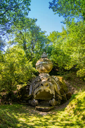 June 28, 2020 - Sacro Bosco (Sacred Grove) or Park of the Monsters of Bomarzo - Mannerist monumental garden. The bear with the Roman rose, coat of arms of the Orsini.のeditorial素材