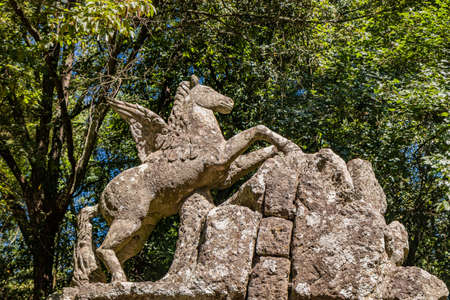 June 28, 2020 - Sacro Bosco (Sacred Grove) or Park of the Monsters of Bomarzo - Mannerist monumental garden. Statue of Pegasus, the winged horse.のeditorial素材
