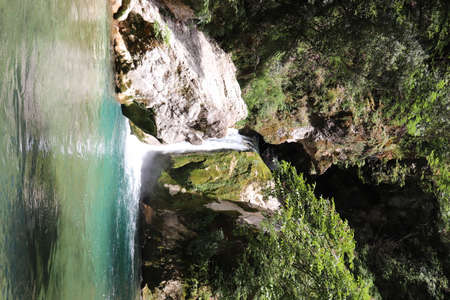 The waterfall of San Benedetto in Subiaco, Rome, Lazio, Italy. Rich vegetation in the woods. Cool place, refreshment from summer heat. Trekking, mountain excursion. Peace, silence, nature.の写真素材