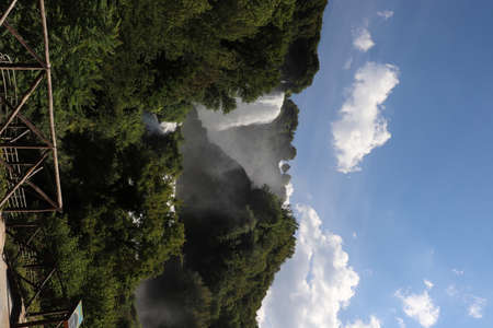 The Cascata delle Marmore or Marmore Falls, in the Nera River valley, in Terni, Umbria, Italy. The strong jet of water generates foam and steam. The blue sky in summer.の写真素材