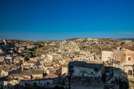 Matera, Basilicata, Italy - The Murgia Materana Park with the typical caves and rock churches carved into the rock. The homes of the ancient inhabitants of the city.の写真素材