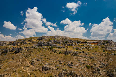 Matera, Basilicata, Italy - The Murgia Materana Park with the typical caves and rock churches carved into the rock. The homes of the ancient inhabitants of the city.の写真素材